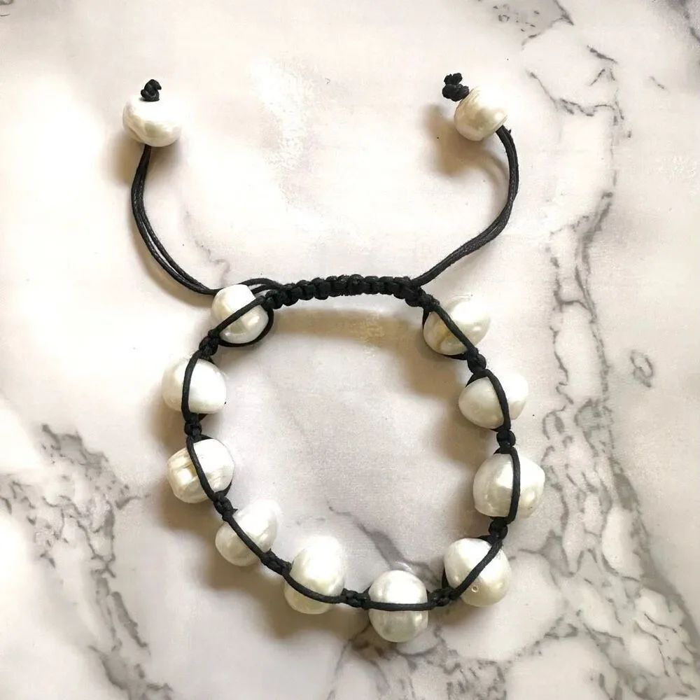 Pearl bracelet on adjustable black silk cord